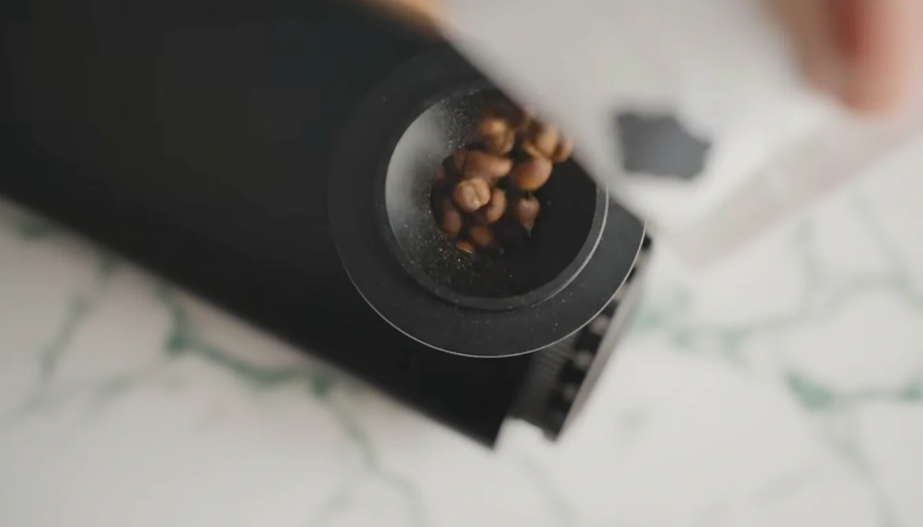 Pouring coffee beans into the Turin DF83V hopper